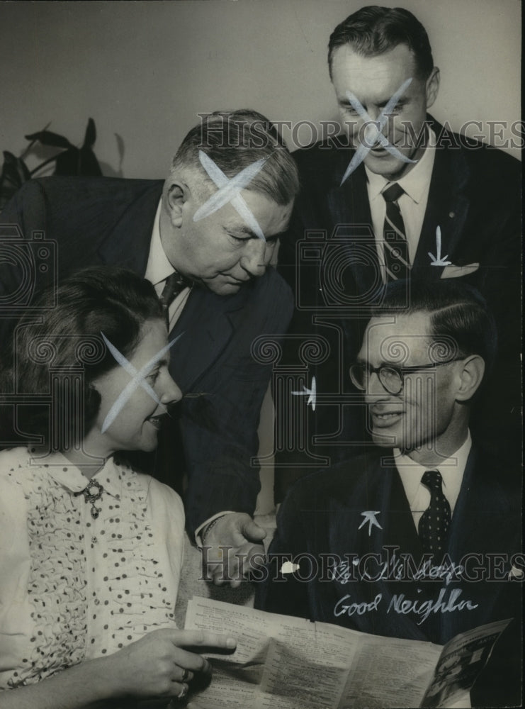 1956 Mrs. David Roberts, III, and others discuss Birmingham Festival - Historic Images