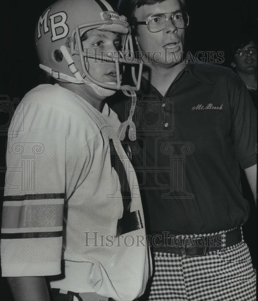 1976, RIck Rhoades, football coach with flanker Steve Glassock - Historic Images