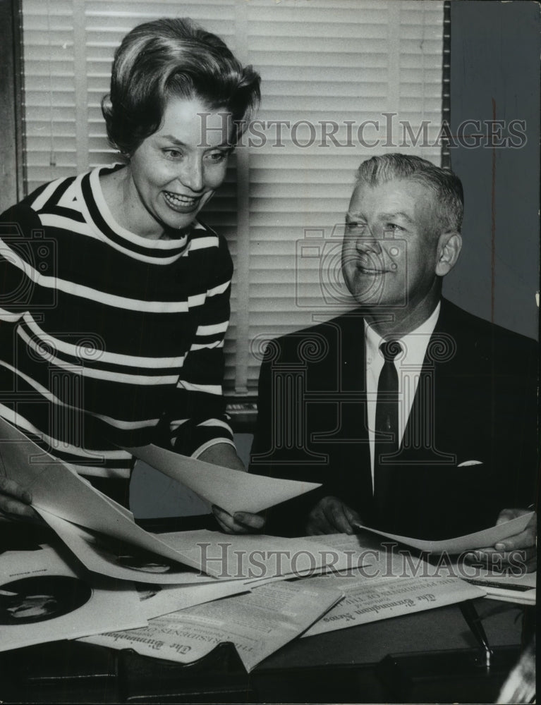 1967 Dr. Kermit Johnson, educator gets information kits for students - Historic Images