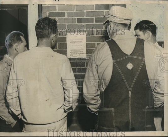 1952, strikers at Republic Steel where the gate is closed. - Historic Images