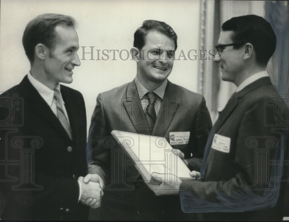 1969 Mark Smith accepting plaque as award from others - Historic Images