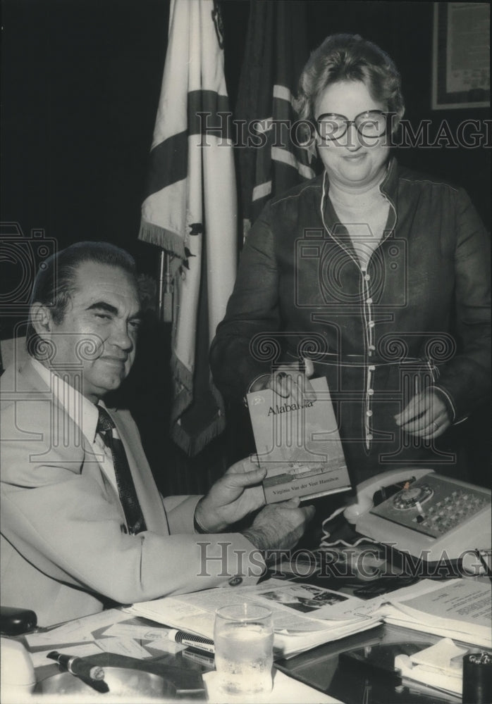 1977, Dr. Virginia Hamilton presenting book to Gov. George Wallace - Historic Images