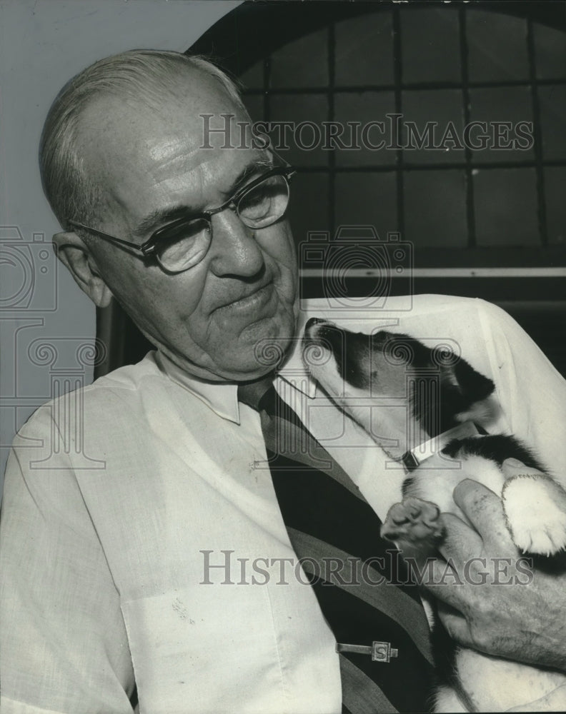 1972, C.J. Smithson of the Birmingham Humane Shelter with Puppy - Historic Images