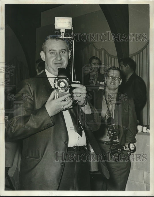 1970, Photographer & state trooper Roy Smith with camera at gathering - Historic Images