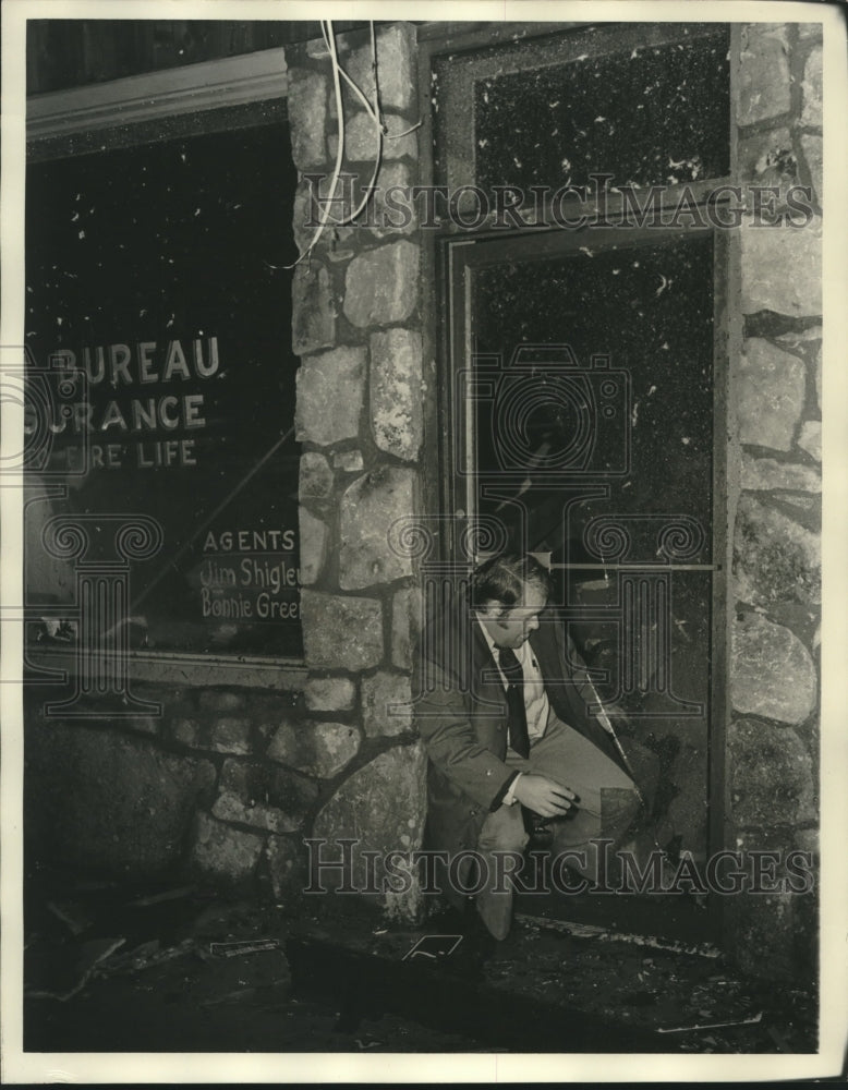 1975 Man Examines Damage Done by Tornado in Alabama - Historic Images