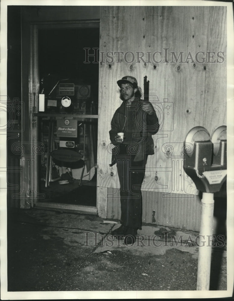 1975 Gary Kendrick Guards Store from Looters after Tornado-Alabama - Historic Images