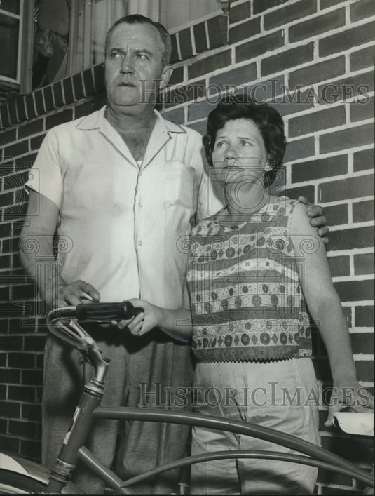 1962, Mr. & Mrs. Bernard Thomas, parents of missing boy, with bicycle - Historic Images