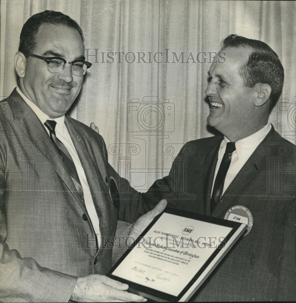 1964, L.E. "Tommy" Thomas, Jim Conner showing plaque they won - Historic Images