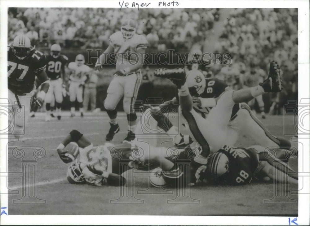 Press Photo Florida Football Carrier Is Stopped By Gang-Tackling Auburn Defense - Historic Images