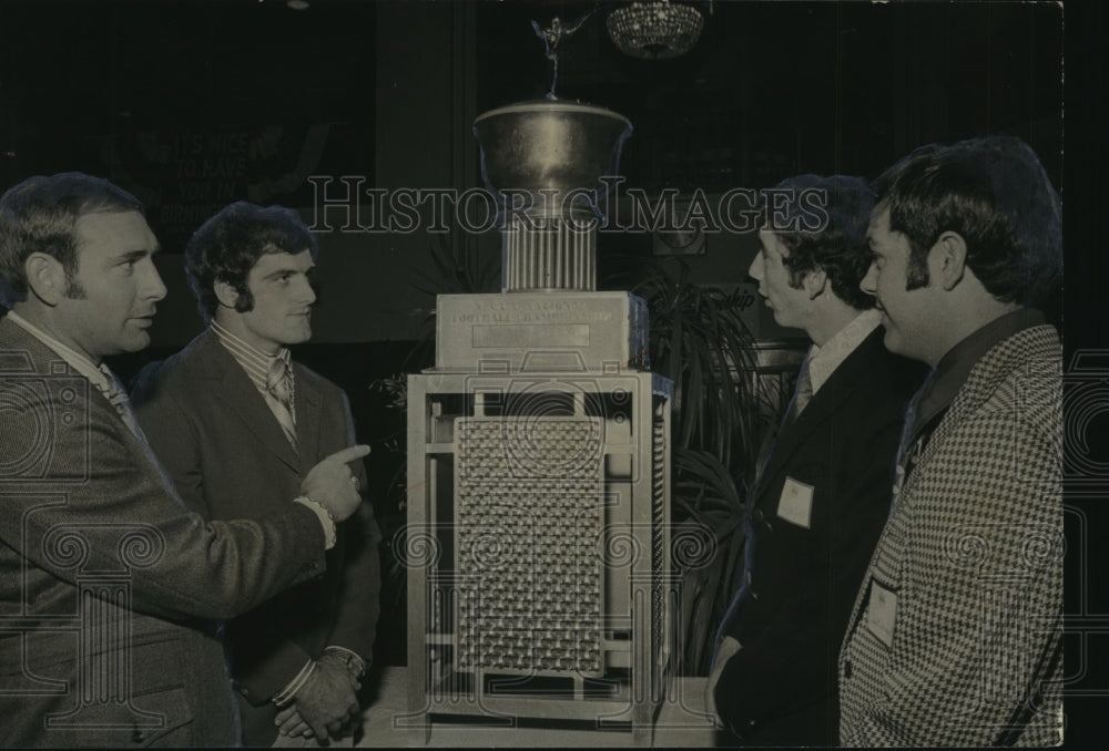 Coach Mickey Andrews with Leo Wright, Others around large Trophy - Historic Images