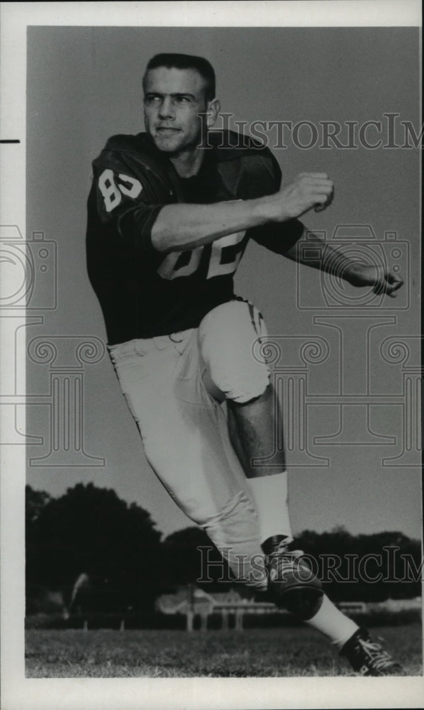 1965 Charlie Stephens, football player, running on field - Historic Images