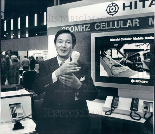 1983 Hitachi Rep Hiroshi Arai & Headset for Mobile Phones Press Photo - Historic Images