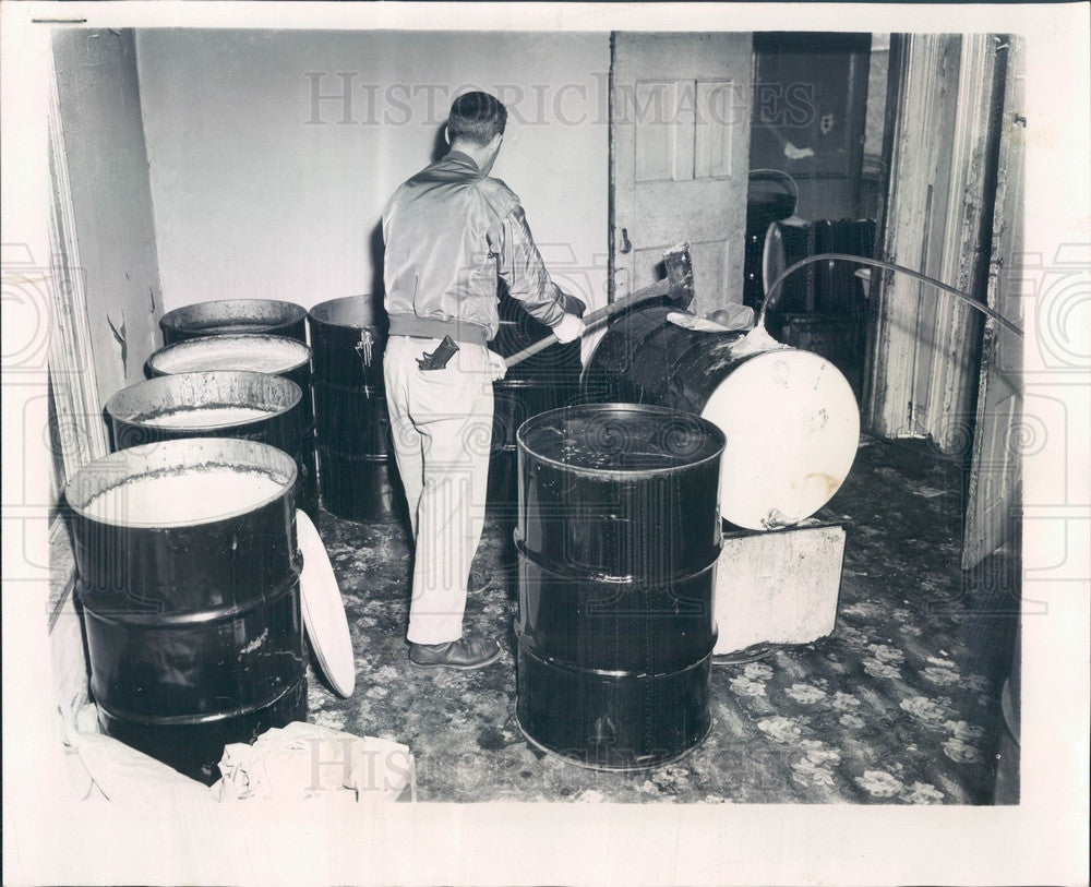 1962 Chicago, Illinois Moonshine Still Busted by Revenue Agent Press Photo - Historic Images