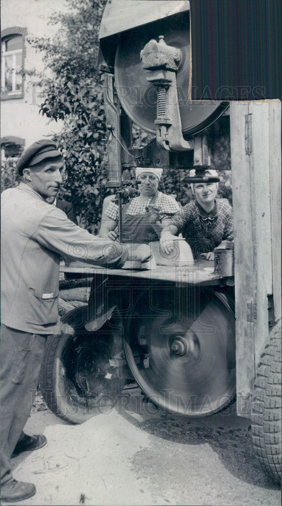 1945 Schuluchtern, Germany Man Cutting Firewood Press Photo - Historic Images