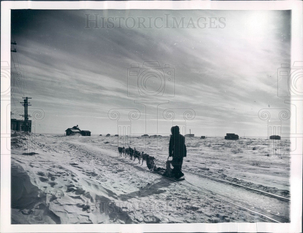 1958 Churchill Manitoba Indian Driving Dogsled Along Railroad Tracks Press Photo - Historic Images