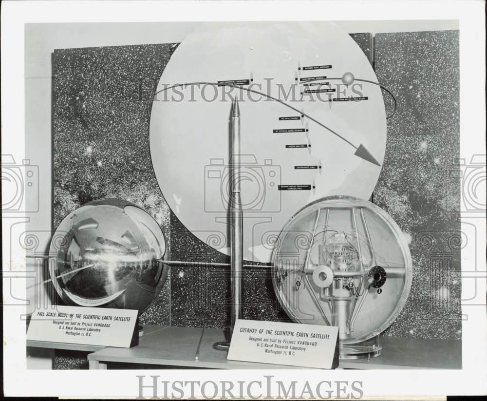 1957 Press Photo Earth satellite cutaway and full model on display in Detroit- Historic Images