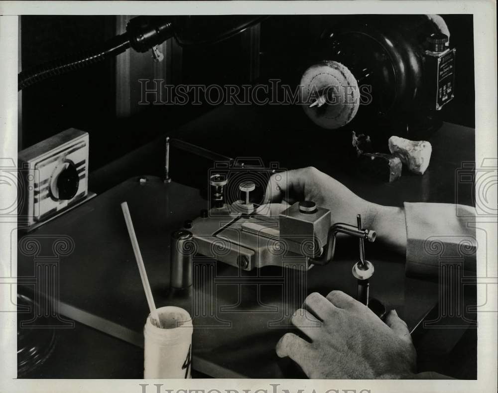 1948 Press Photo A technician polishes the inside of a contact lens - afx00875- Historic Images