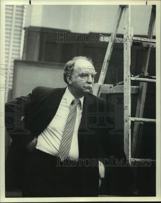 Press Photo Man stands next to ladder at Supervisor's Trial - Historic Images