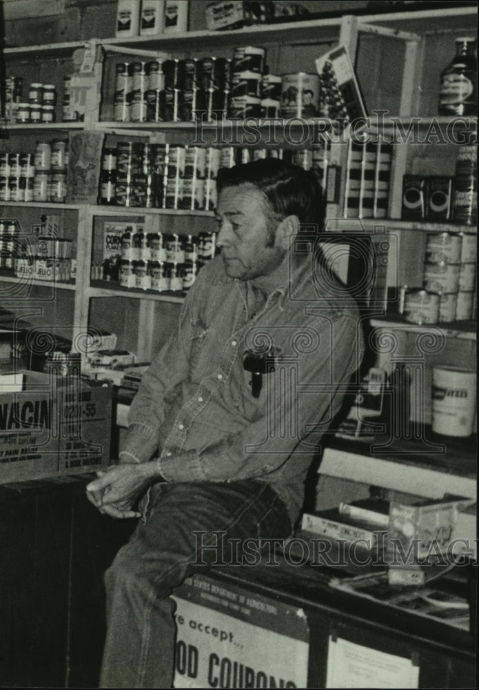 Man at grocery store in Gainestown, Alabama - Historic Images