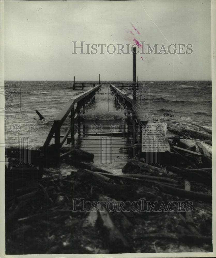 1965 Damaged fishing pier from Hurricane Betsy in Alabama - Historic Images