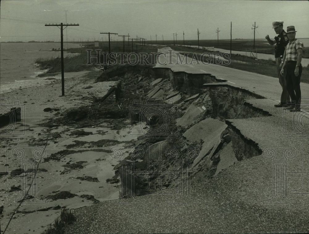 1969 Police inspecting road damaged by Hurricane Camille, Alabama - Historic Images
