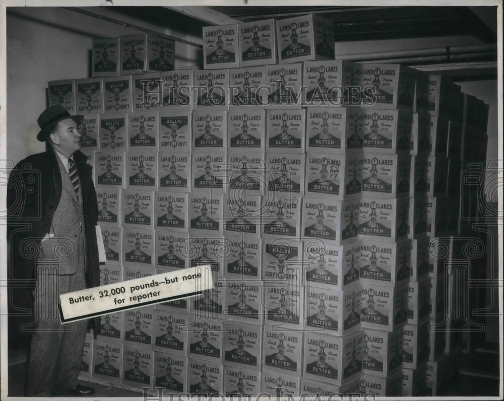 1946 Press Photo Howard Beaufait looks at Butter Supply. - Historic Images