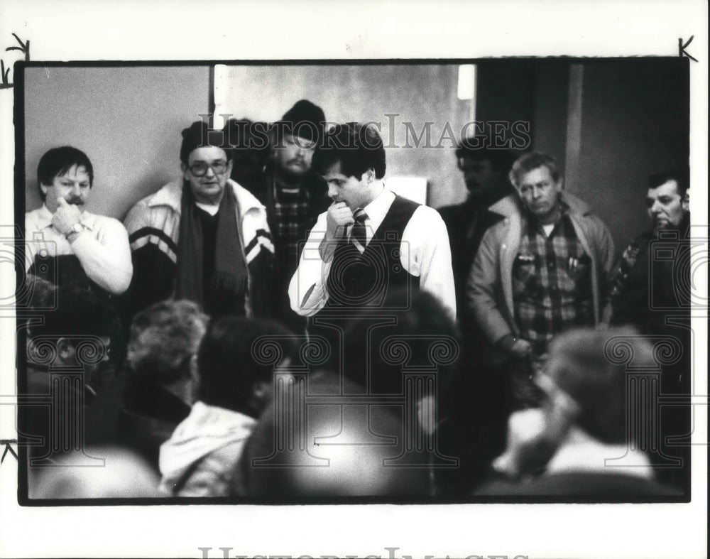 1985, Dennis Eckhart listens at the meeting in Mentor Civic Center - Historic Images