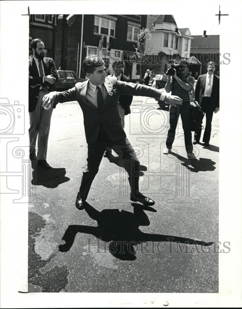 1988 Press Photo  Michael S. Dukakis throws baseball back to spectator - Historic Images