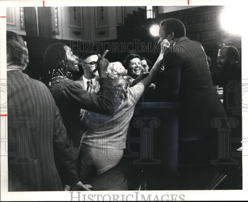 1980 Press Photo George L. Forbes gets congratulatory pinch on cheek - Historic Images