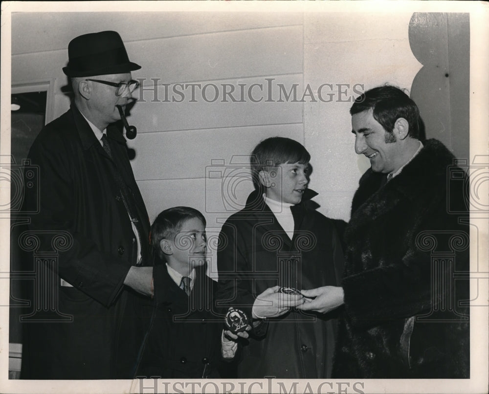 1969 Press Photo Nick Miletti Barons owner present Hockey Pucks to David Cannon - Historic Images