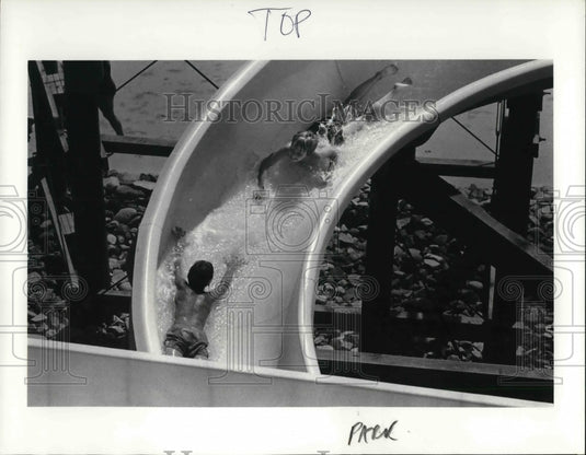 1983 Press Photo Two People Going Down Geauga Lake Water Slide in Ohio - Historic Images
