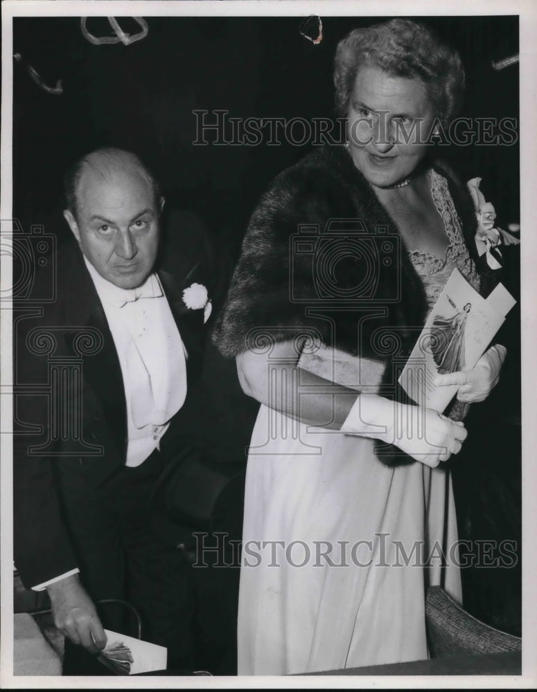 1955 Henri P. Junod escorts his cousin Mrs. R.Livingston Ireland - Historic Images