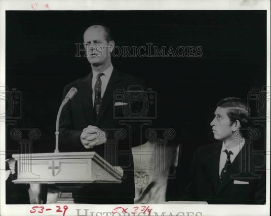 1974, Royal family of England Prince Philip & son Charles looking on - Historic Images