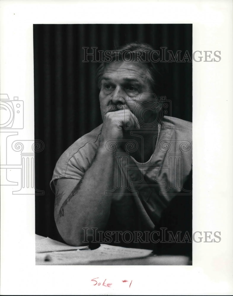 1991, Ted Doke listen to opening statement during hearing - Historic Images