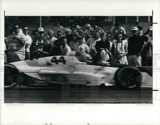 1990 Press Photo Fans watch Indy Cars go into the pits Indy practice session - Historic Images