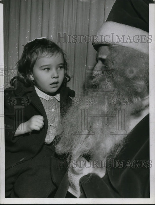 1961 The little girl with Santa Claus  - Historic Images