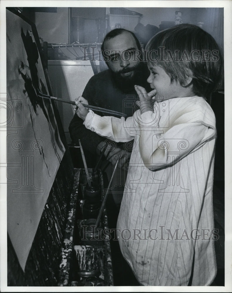 1971 Chuck Smith helps a pupil Susan Daly with her paint  - Historic Images