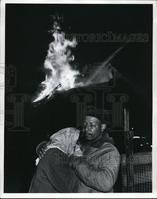 1971 Herbert Saunders with his wife after the blaze of fire - Historic Images