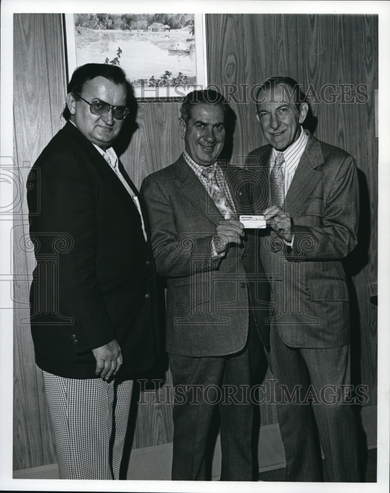 Undated Tony Granata presents honorary membership card in Cleveland - Historic Images
