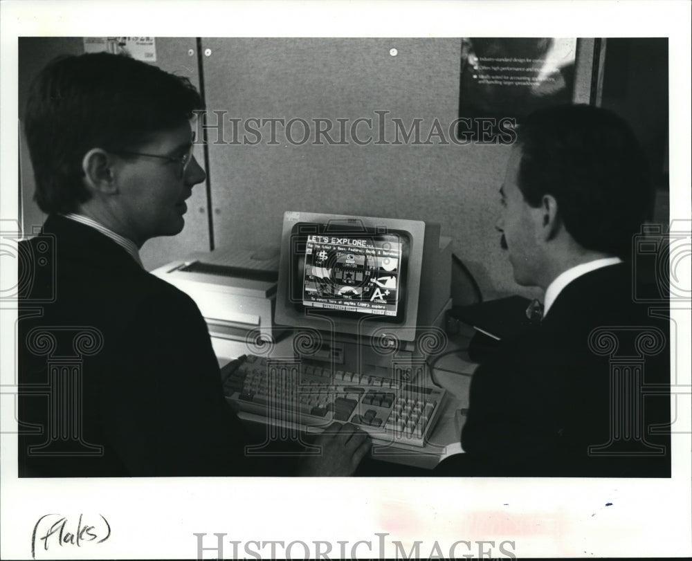 1991 Press Photo Raymond Gay shows Patrick Gallagher the intricasies-Historic Images