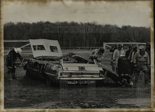 1973 Members of Fire Dept practice with Power Saws at Burton Fair - Historic Images