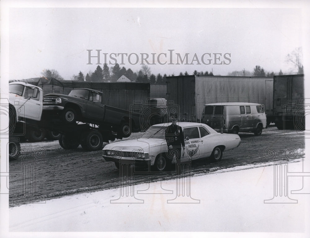 1968 Patrolman Charles Shipley w/ white knight patrol cars - Historic Images