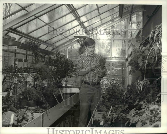 1981, Scott Adamson in greenhouse - cva65744 - Historic Images