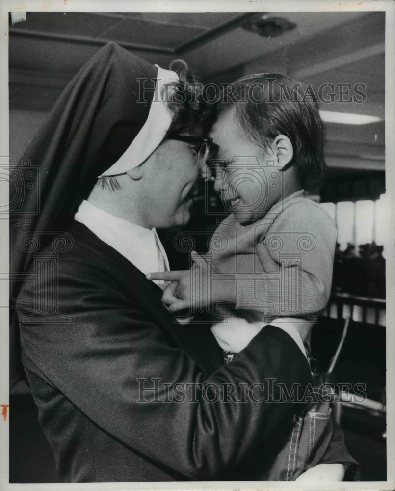 1975, Mother Immaculate of Vincentian Sisters of Charity hugs Hung - Historic Images