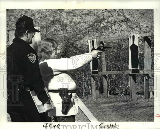 1987, Bob Viancourt, Chief Range instructor teach Sandi Velbeck - Historic Images