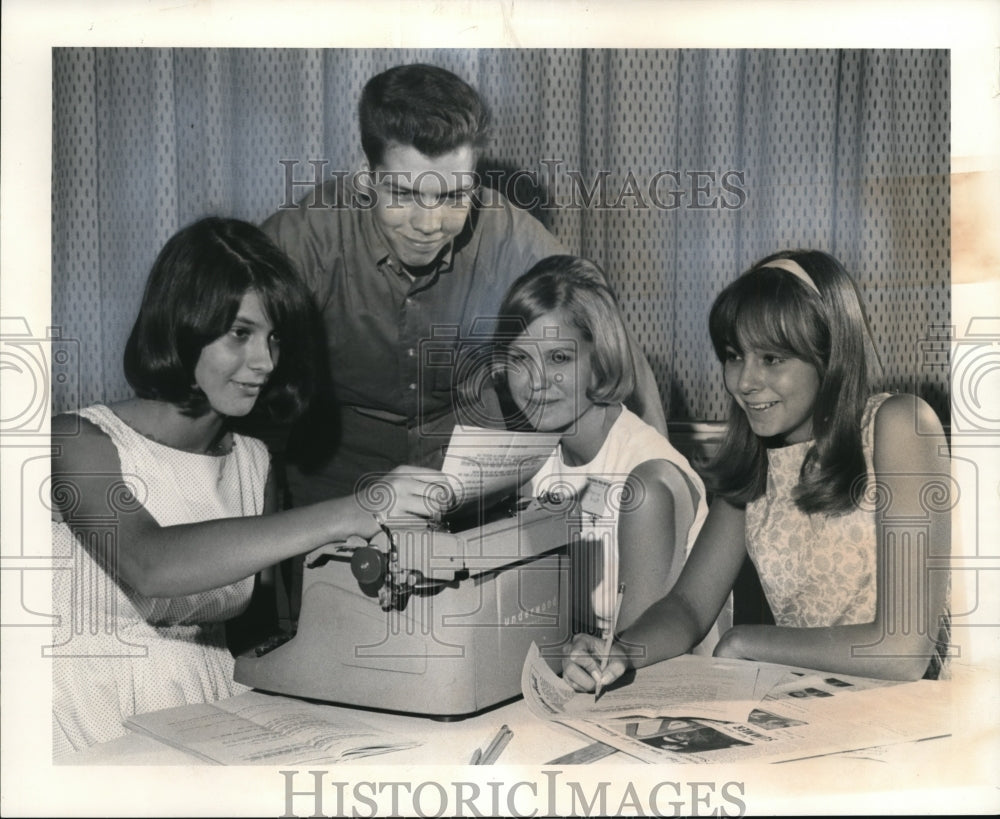 1965, The student writers review a copy of the Plain Dealer - Historic Images