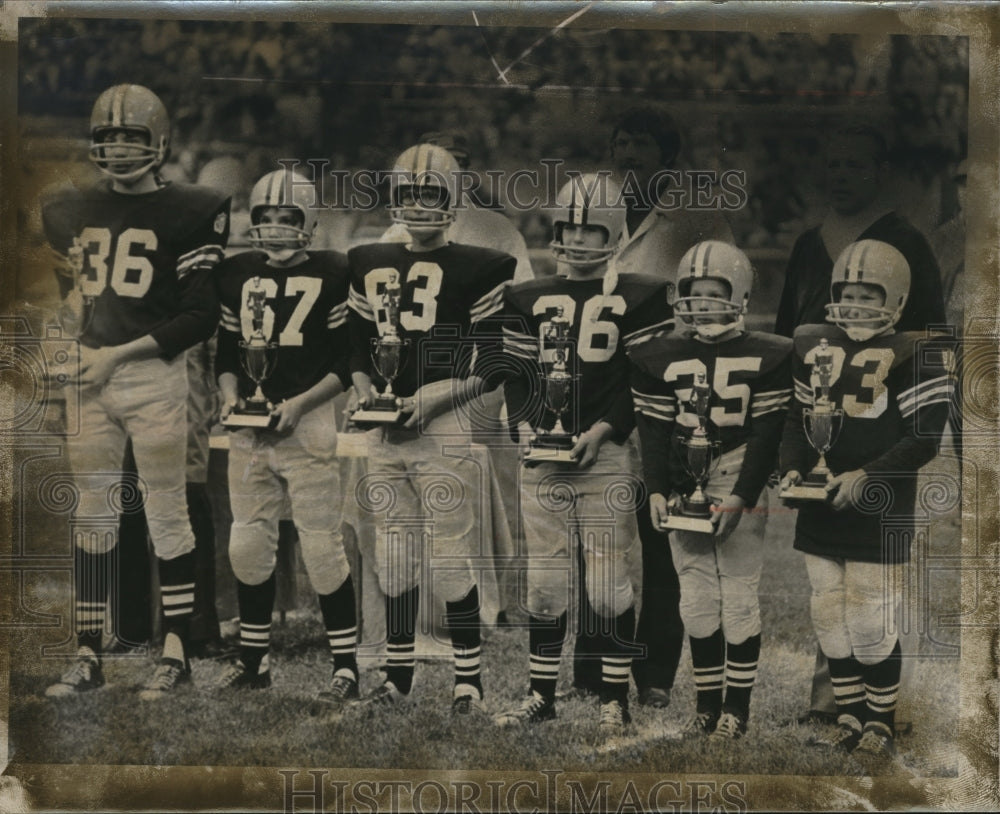 1973 The football team members are Kevin, Page, Tim, Billy and Mikey - Historic Images