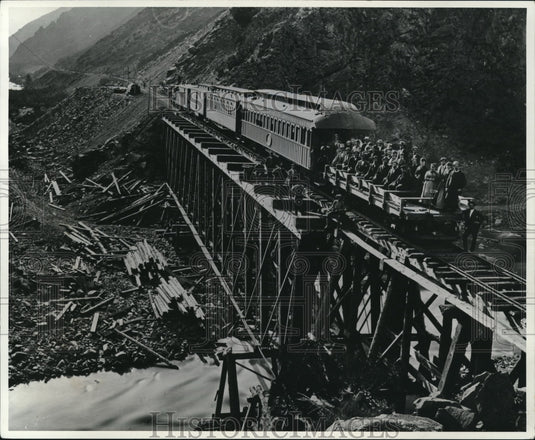1970 1869 excursion train pushes a flatcar load of sight - Historic Images