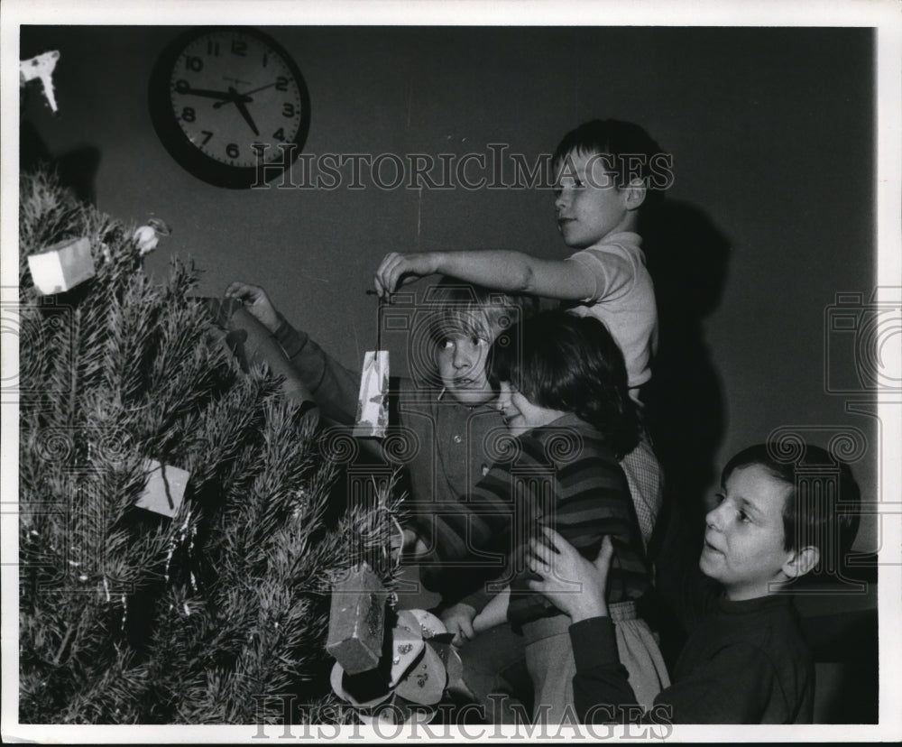 1969 Youngster from Orchard Elem. School and PAL decorates Tress - Historic Images