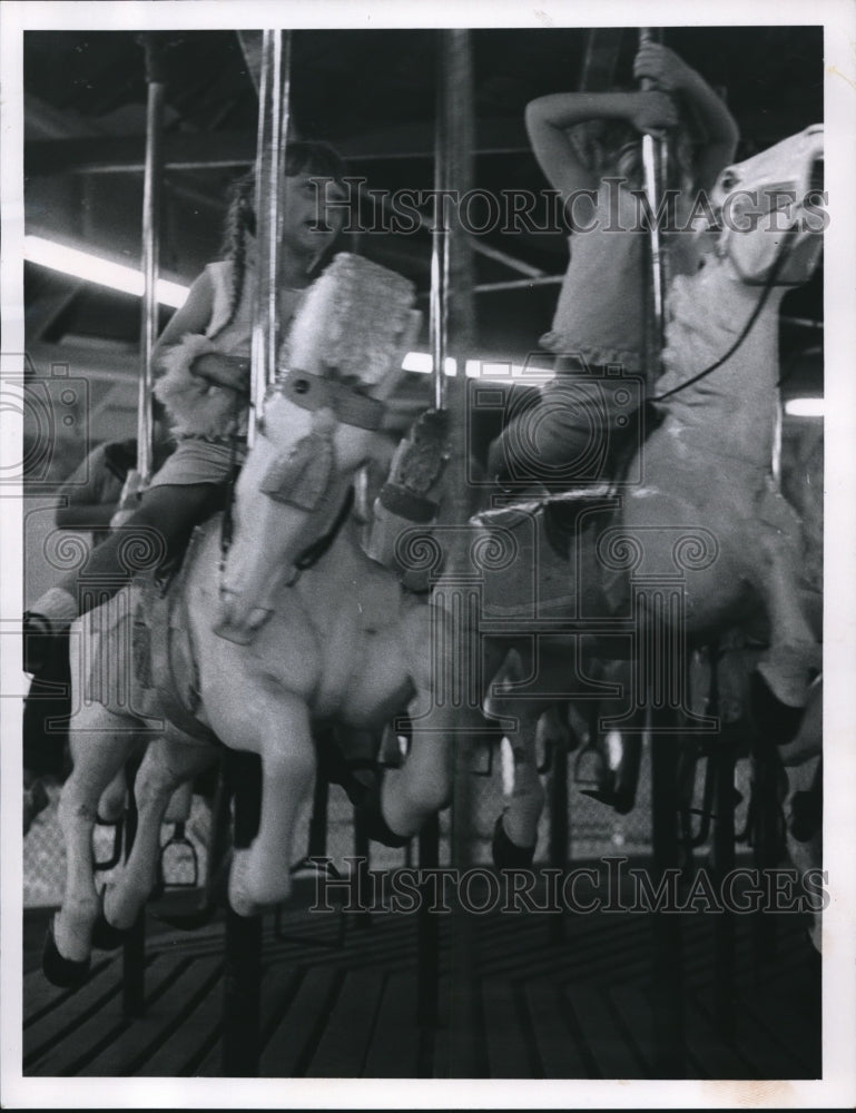 1967 Press Photo Tonda Lee Marsh rides a bronco on the Merry Go Round - cva74757 - Historic Images